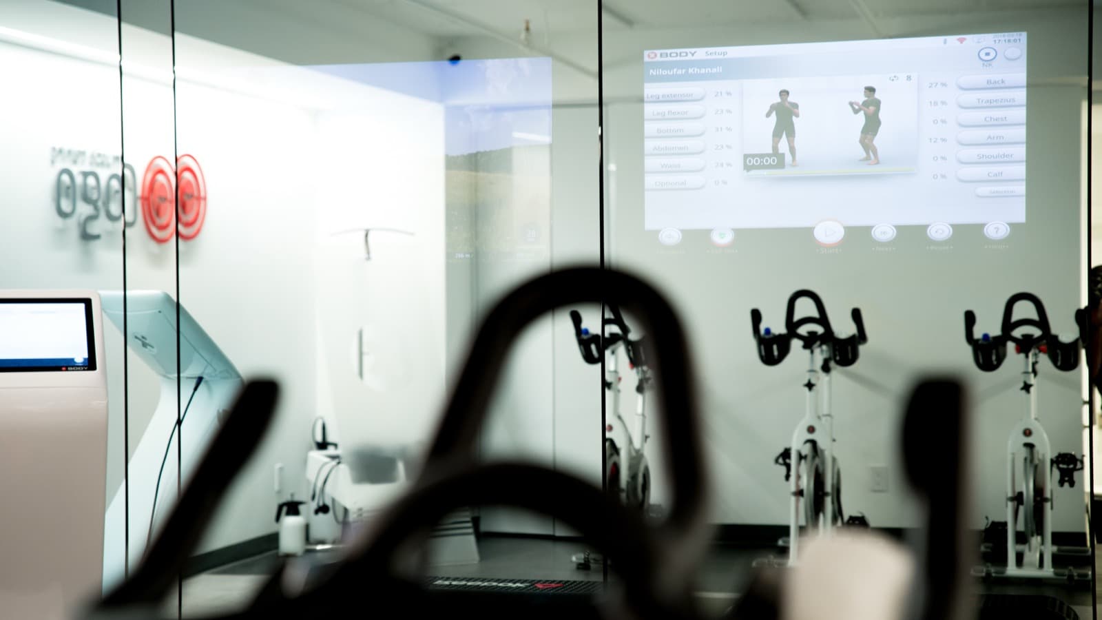 The EMS training floor seen through the studio's glass partition